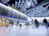 People walking through the terminal of an airport