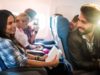 Passengers talking while sitting in a plane