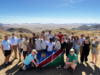 Group of people holding Namibian flag during Fam Trip in Namibia
